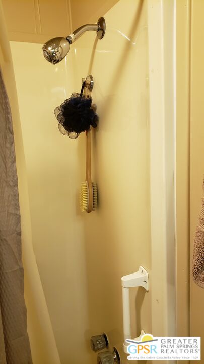 374 Buffalo Road Cathedral City, CA 92234 - Photo 14 of 33 a bathroom with a shower and a toilet