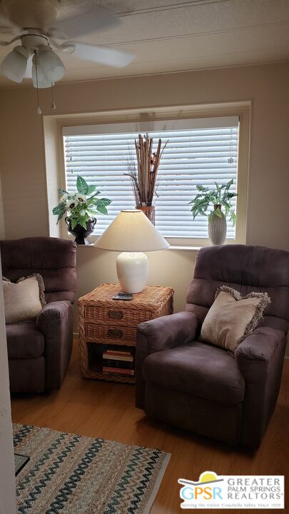 374 Buffalo Road Cathedral City, CA 92234 - Photo 16 of 33 a living room with furniture and a potted plant