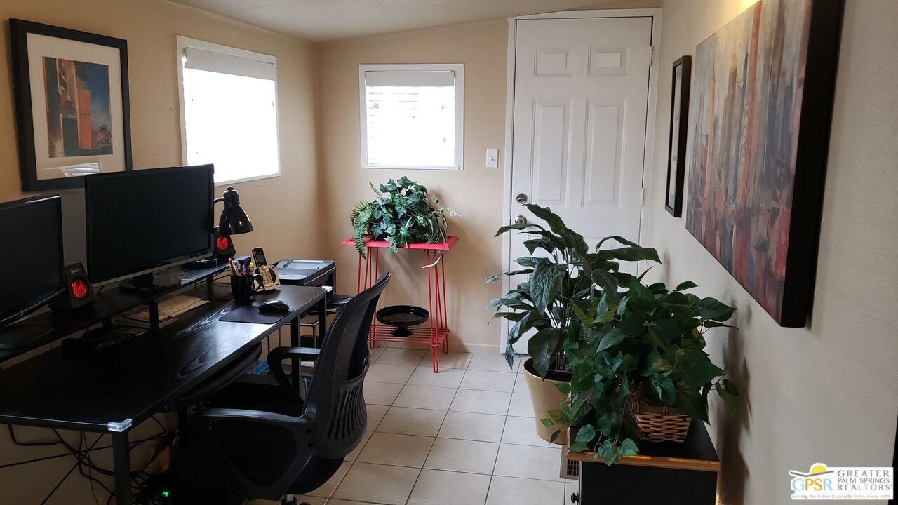 374 Buffalo Road Cathedral City, CA 92234 - Photo 18 of 33 a dining room with furniture and a potted plant