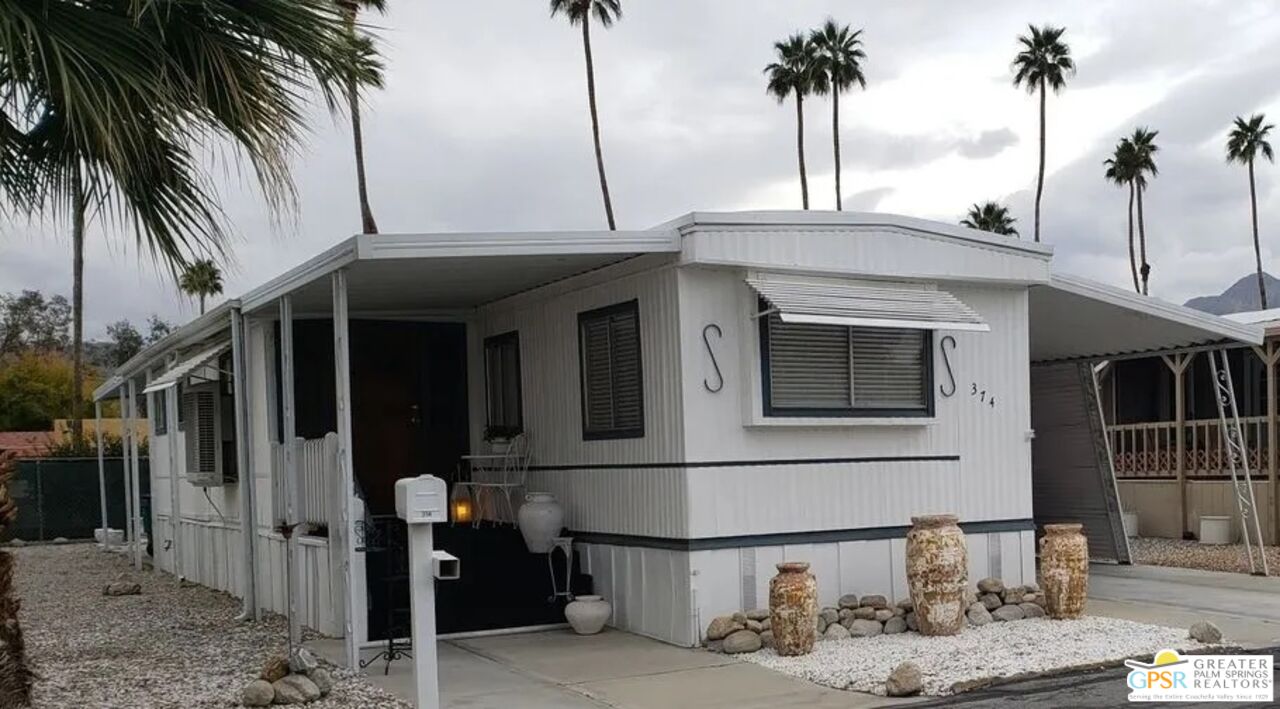 374 Buffalo Road Cathedral City, CA 92234 - Photo 2 of 33 a front view of a house with garage