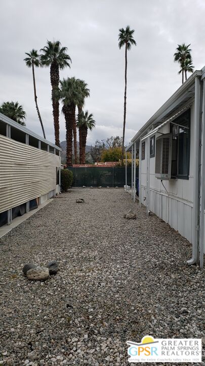 374 Buffalo Road Cathedral City, CA 92234 - Photo 26 of 33 a view of a house with a backyard