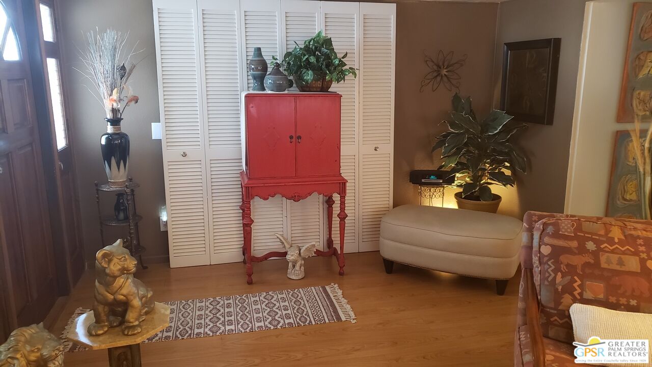 374 Buffalo Road Cathedral City, CA 92234 - Photo 5 of 33 a living room with furniture flowerpot and wooden floor