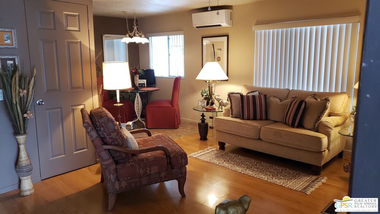 374 Buffalo Road Cathedral City, CA 92234 - Photo 6 of 33 a living room with furniture and a lamp