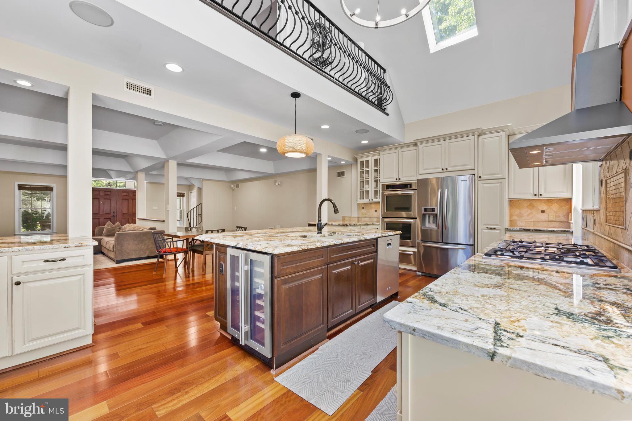 11019 Ring Road Reston, VA 20190 - Photo 26 of 78 a kitchen with stainless steel appliances granite countertop a stove and a refrigerator
