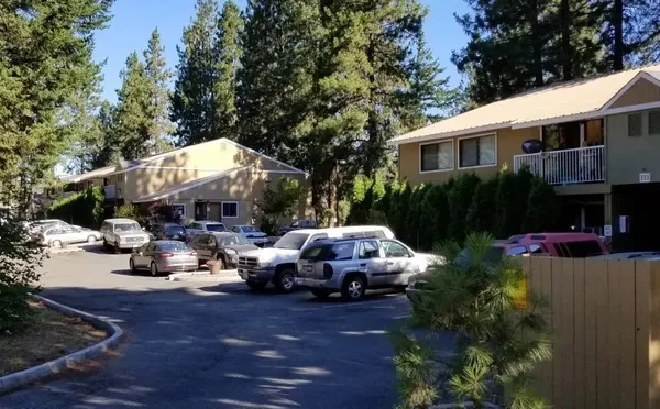 a view of house with car parked