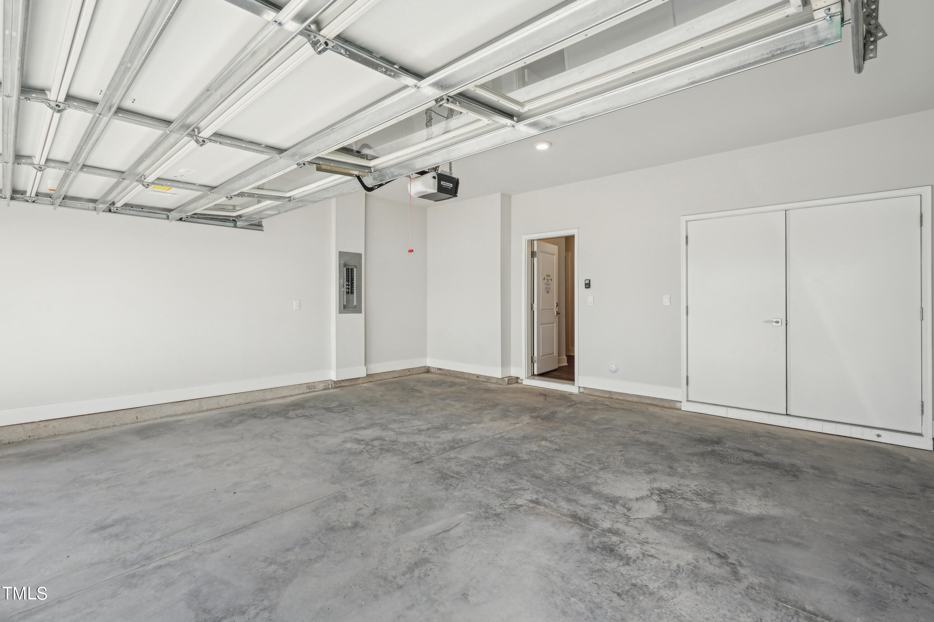 11548 Helmond Way, Unit 117 Raleigh, NC 27617 - Photo 18 of 38 Two-Car Garage with Storage