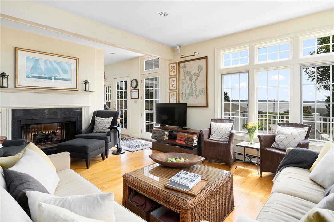 34 Decatur Avenue Jamestown, RI 02835 - Photo 13 of 40 Gas fireplace in living room. Access to deck as well