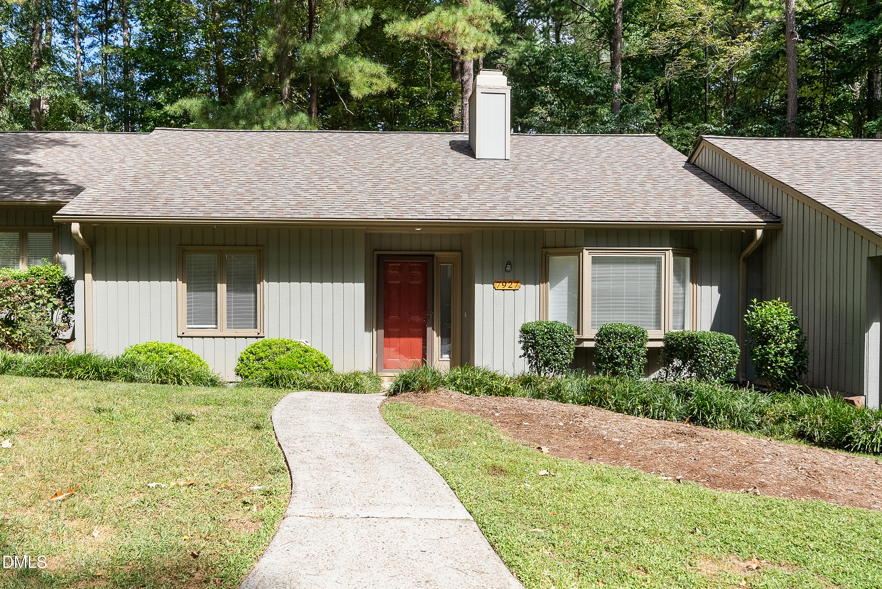 a house view with a garden space