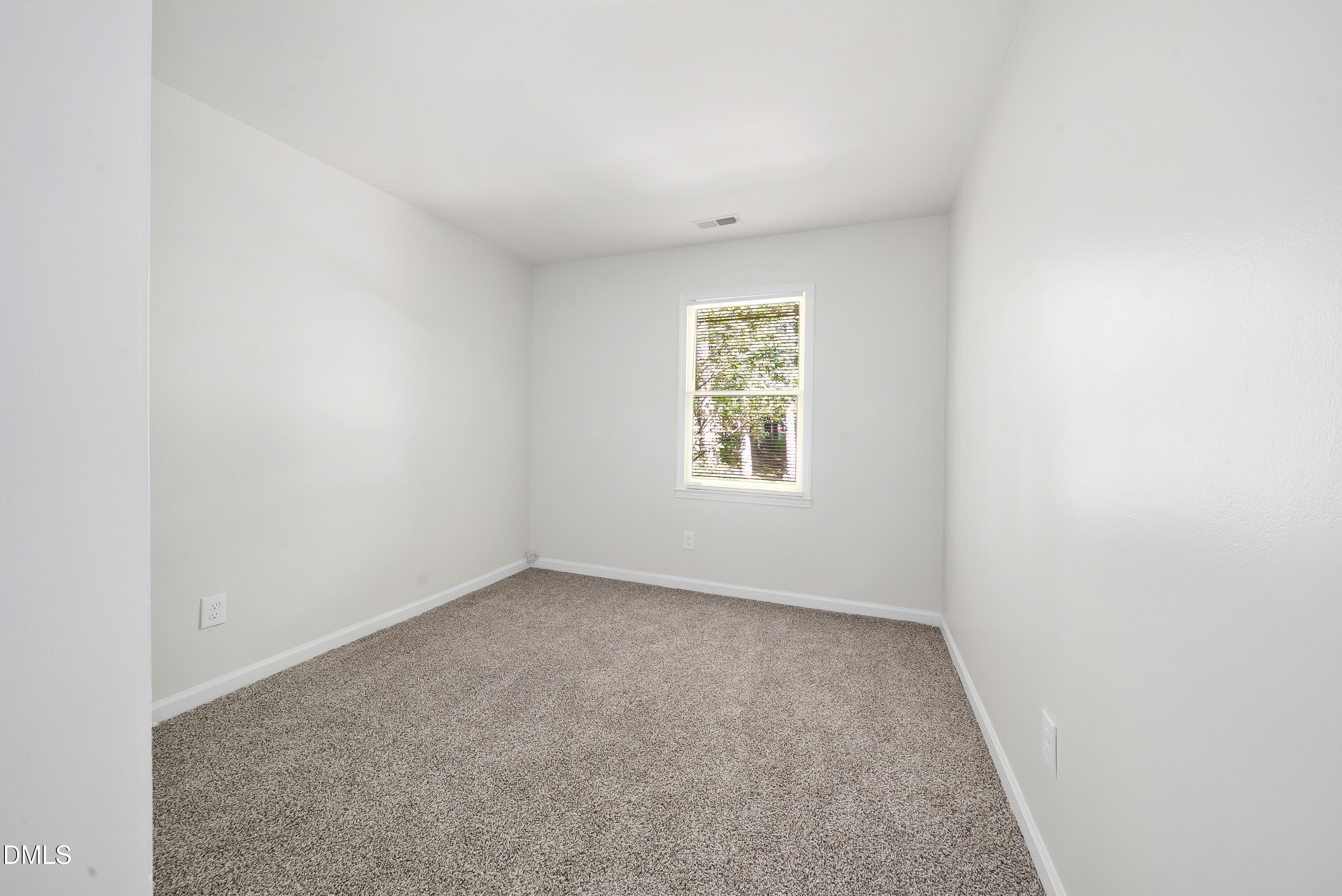 7927 Brown Bark Place Raleigh, NC 27615 - Photo 14 of 25 an empty room with a window