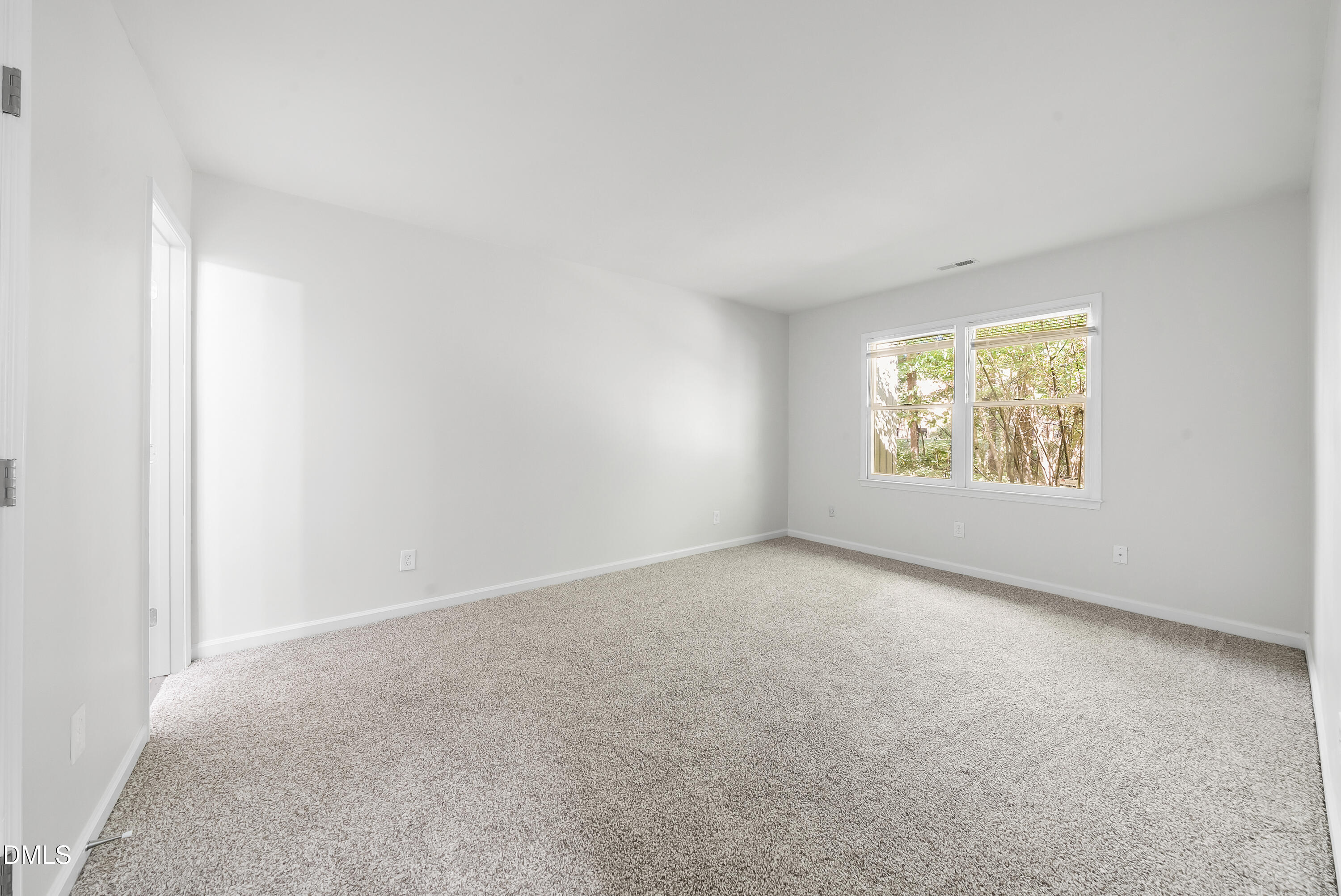 7927 Brown Bark Place Raleigh, NC 27615 - Photo 15 of 25 an empty room with windows
