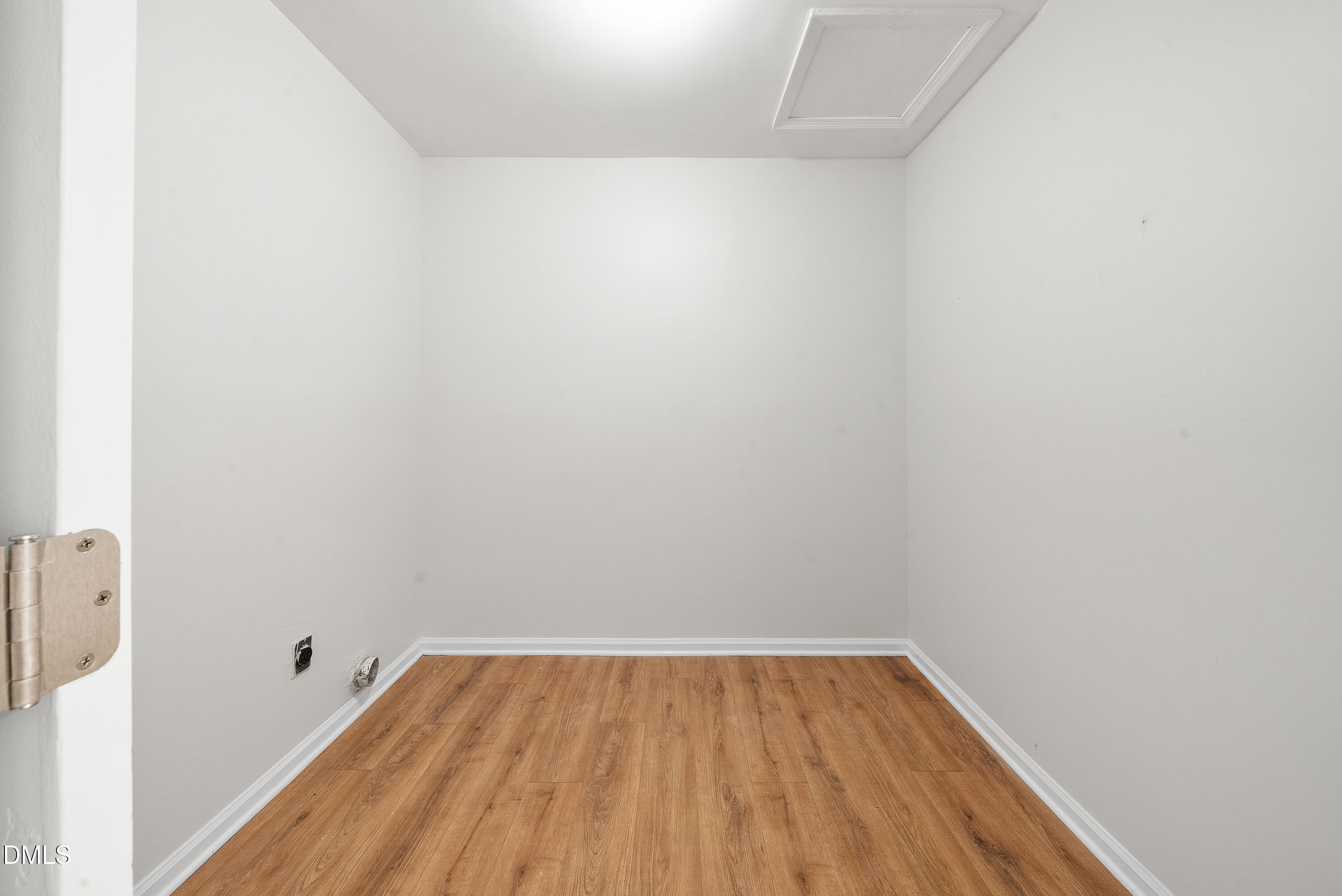 7927 Brown Bark Place Raleigh, NC 27615 - Photo 20 of 25 a view of a room with wooden floor