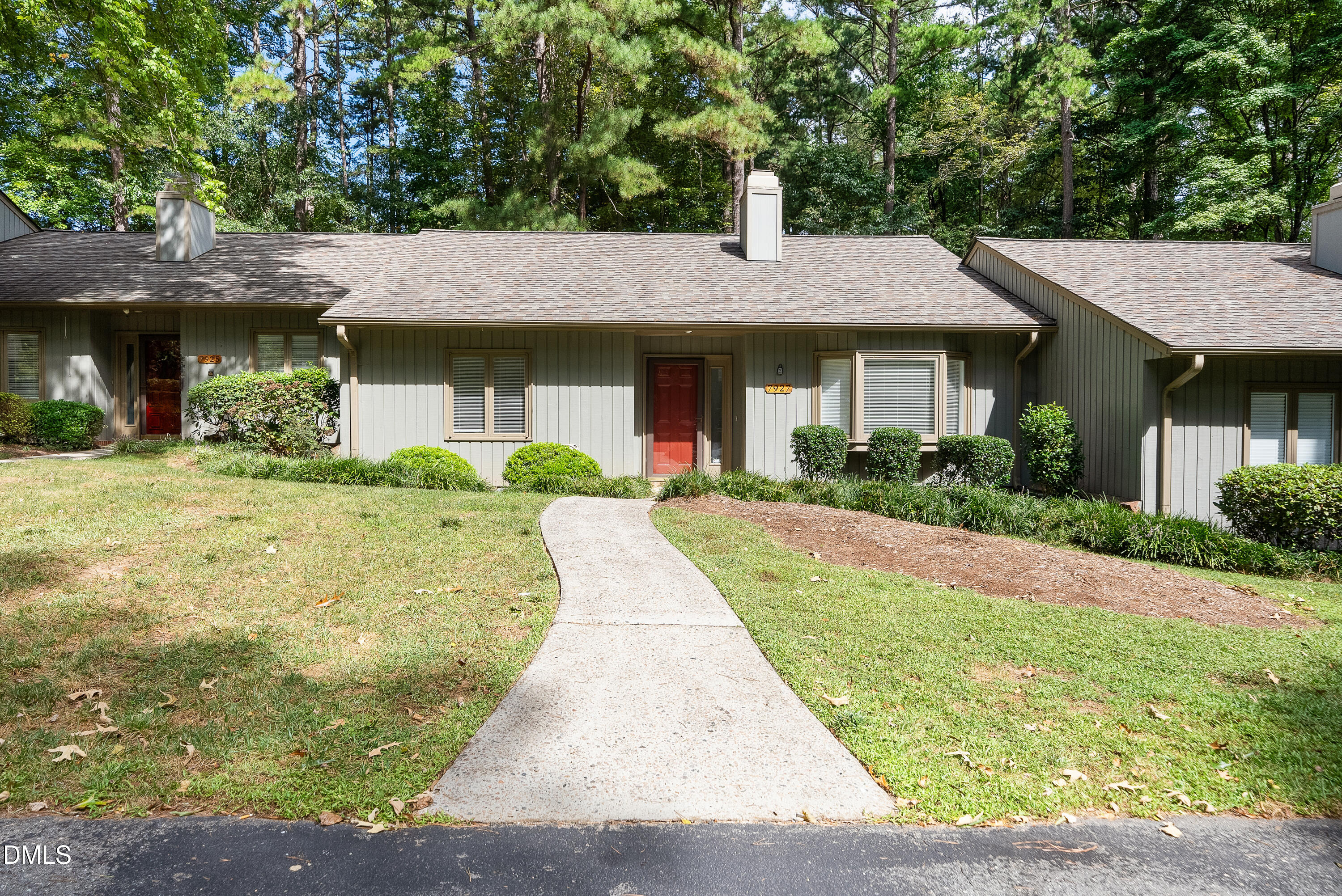7927 Brown Bark Place Raleigh, NC 27615 - Photo 2 of 25 a front view of a house with a yard