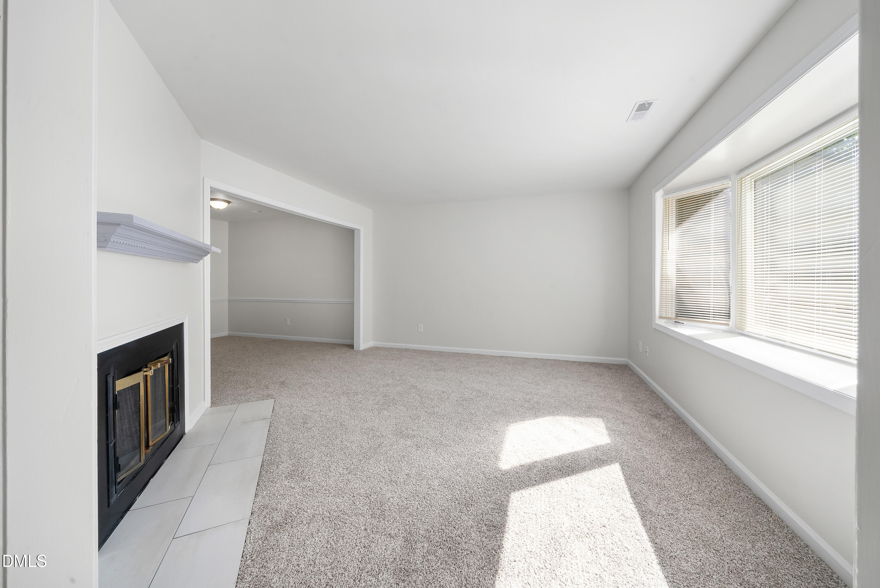 7927 Brown Bark Place Raleigh, NC 27615 - Photo 4 of 25 an empty room with windows