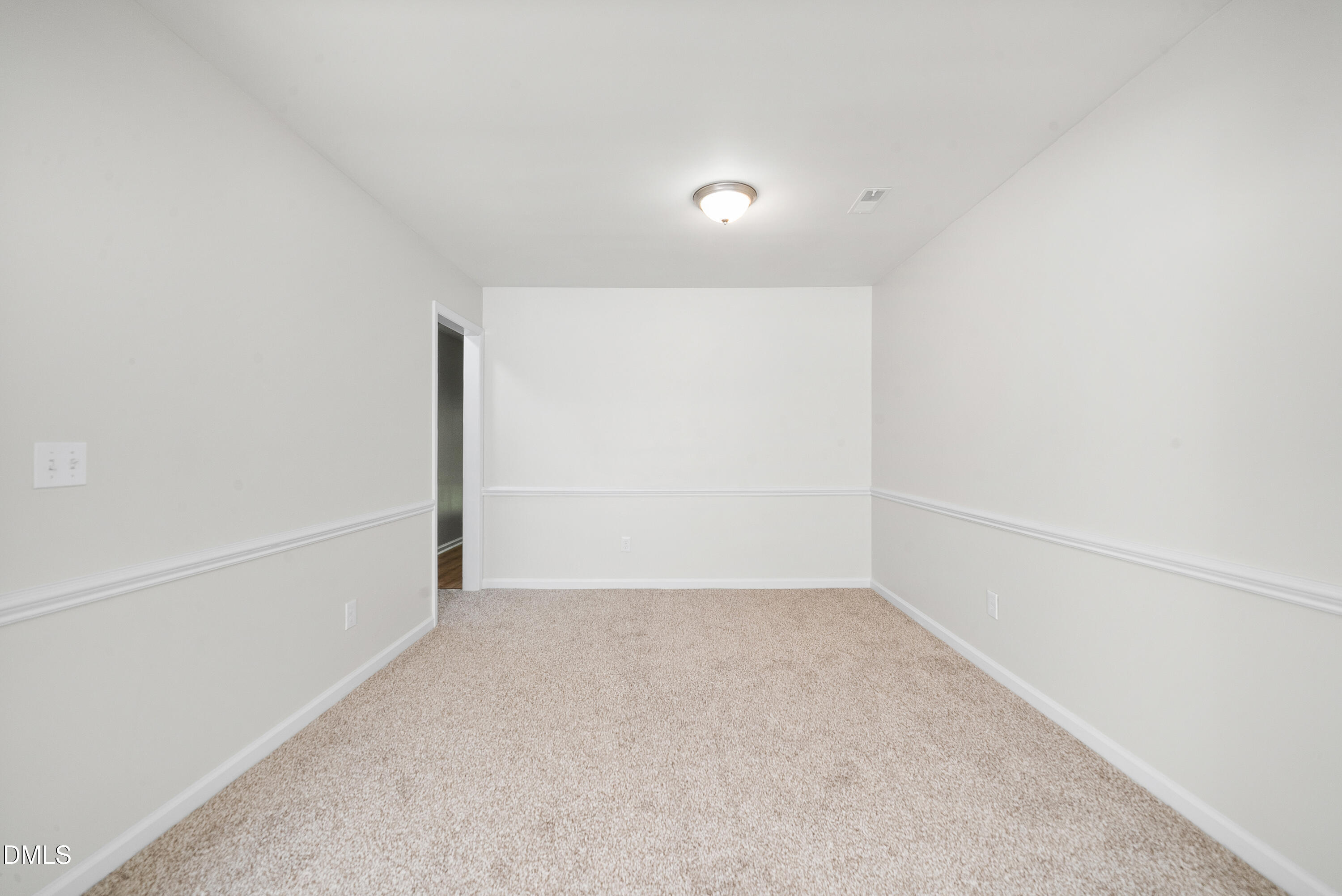 7927 Brown Bark Place Raleigh, NC 27615 - Photo 6 of 25 a view of an empty room
