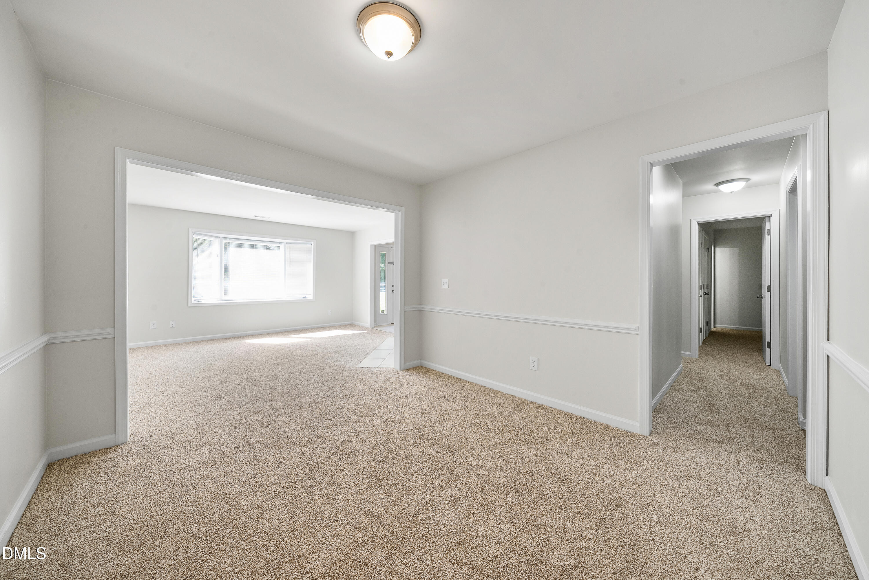 7927 Brown Bark Place Raleigh, NC 27615 - Photo 8 of 25 an empty room with windows and closet