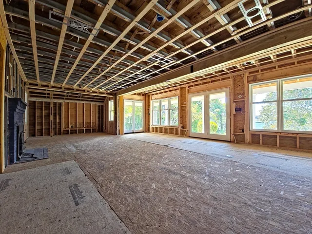 a view of an empty room with a balcony