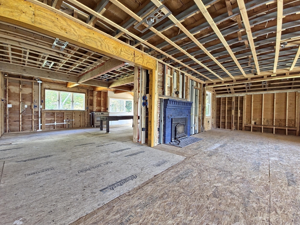 10 Squeteague Harbor Road Bourne, MA 02534 - Photo 23 of 41 a view of an empty room with a fireplace