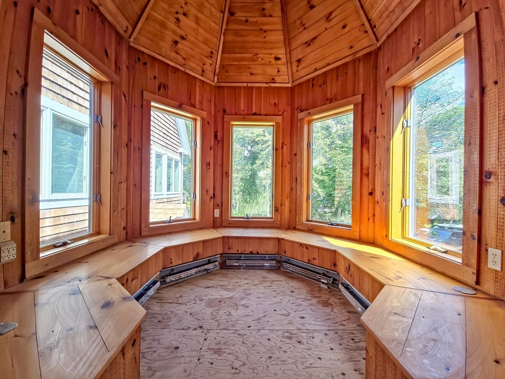 10 Squeteague Harbor Road Bourne, MA 02534 - Photo 25 of 41 a view of a bathroom with a tub and large windows