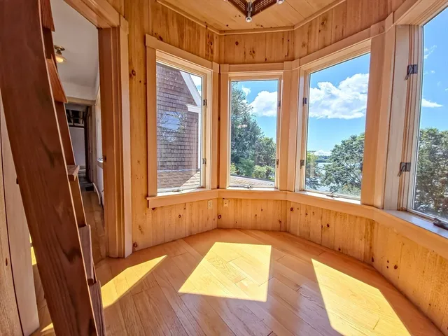 a view of a bathtub in a room with a window