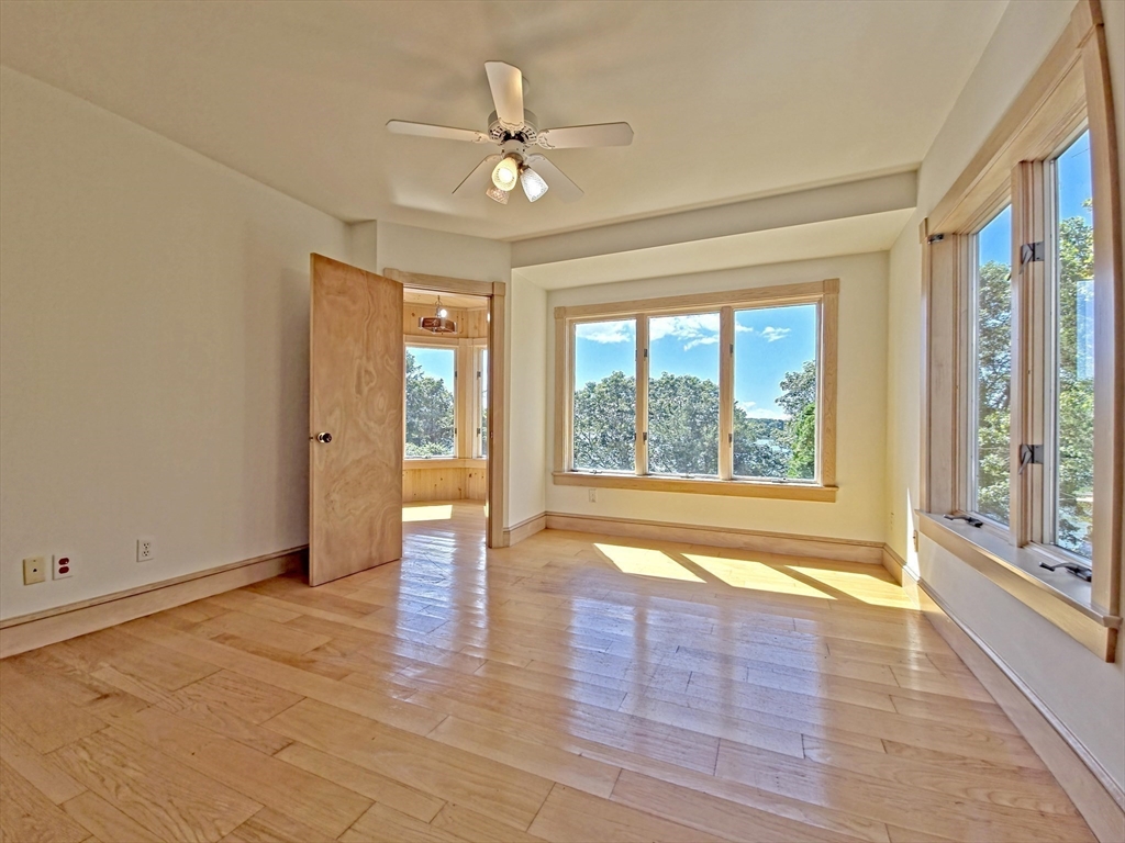 10 Squeteague Harbor Road Bourne, MA 02534 - Photo 27 of 41 wooden floor in an empty room with a window