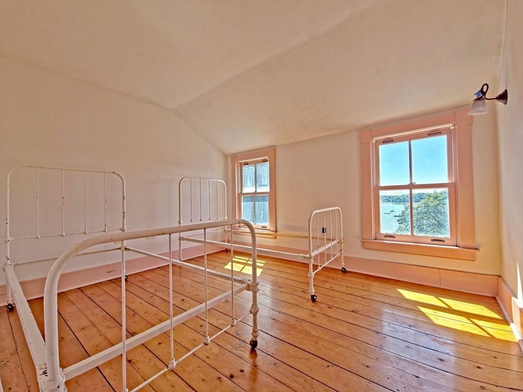10 Squeteague Harbor Road Bourne, MA 02534 - Photo 31 of 41 a room with a patio and wooden floor