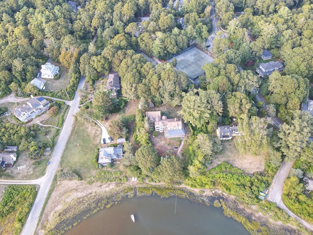 10 Squeteague Harbor Road Bourne, MA 02534 - Photo 38 of 41 an aerial view of residential houses with outdoor space