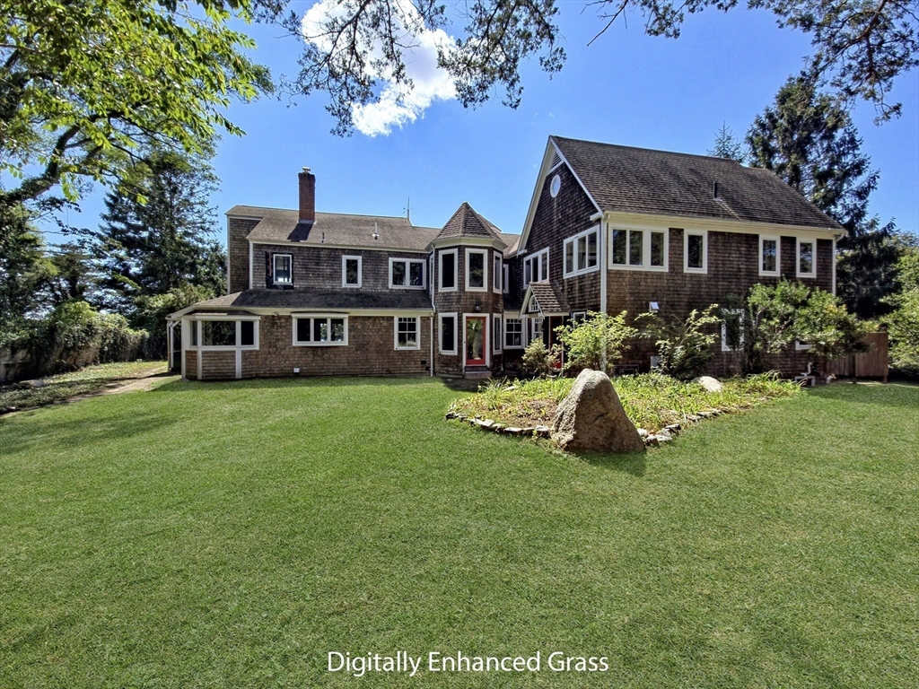 10 Squeteague Harbor Road Bourne, MA 02534 - Photo 6 of 41 a view of house with a garden