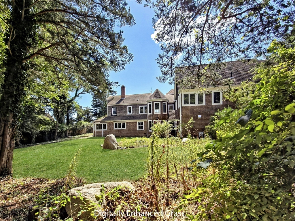 10 Squeteague Harbor Road Bourne, MA 02534 - Photo 8 of 41 a view of a house with garden and trees