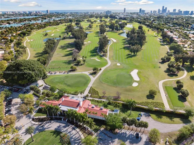 an aerial view of a residential houses with outdoor space