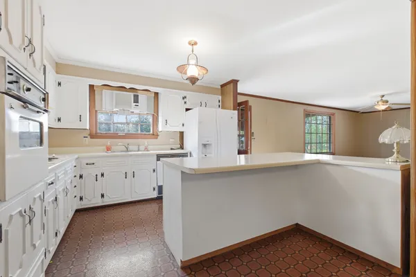 a kitchen with cabinets a sink and dishwasher