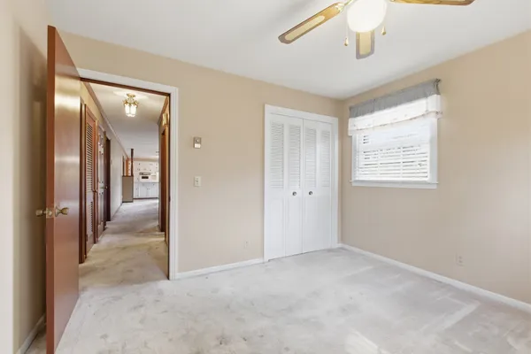 a view of hallway with windows