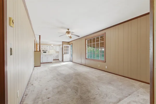 a view of livingroom with furniture and refrigerator
