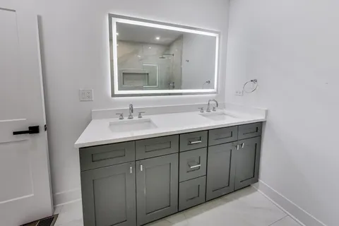 a bathroom with a sink and a mirror