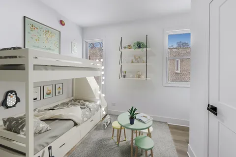 a living room with furniture and white walls