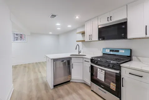 a kitchen with a stove and a microwave