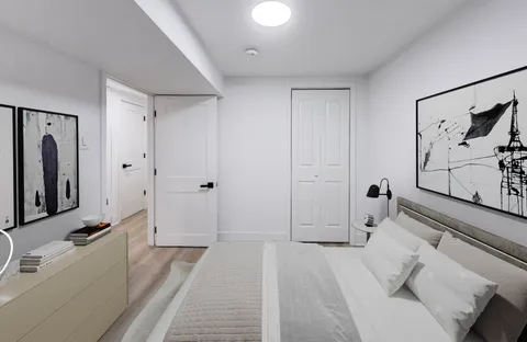 a bathroom with a tub sink and mirror