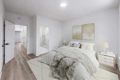 a bedroom with a bed and a couch