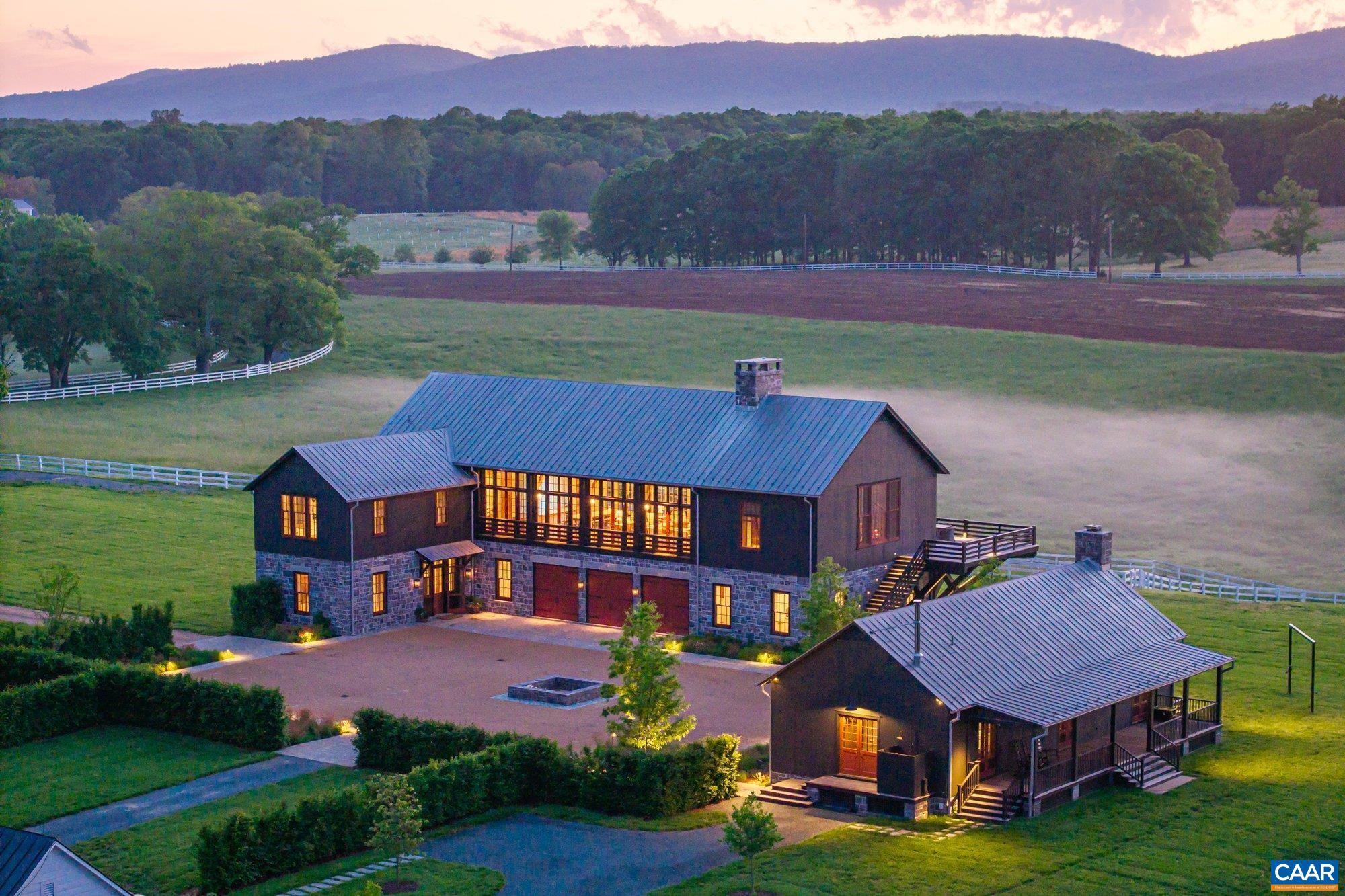 an aerial view of a house with a garden and a yard