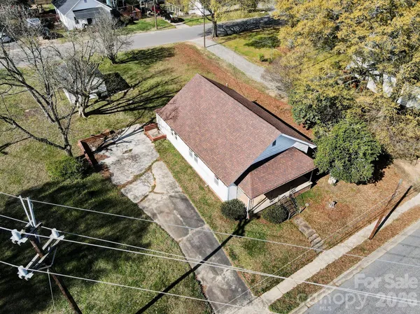 an aerial view of house with yard