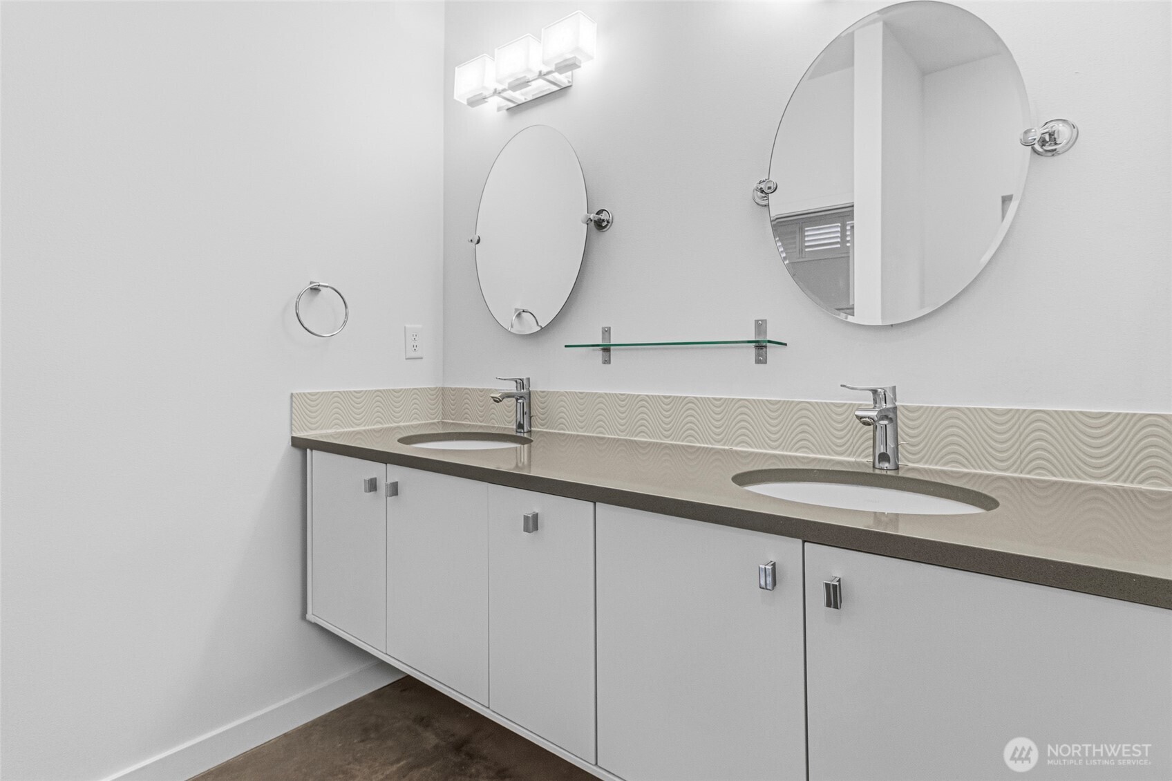 4205 Plum Point Road Grand Coulee, WA 99133 - Photo 28 of 39 a bathroom with a double vanity sink and a mirror