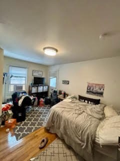 23 Heath Street, Unit 1 Brookline, MA 02445 - Photo 13 of 16 a bedroom with two beds and a couch