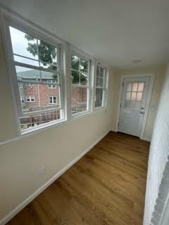 23 Heath Street, Unit 1 Brookline, MA 02445 - Photo 14 of 16 a view of empty room with windows