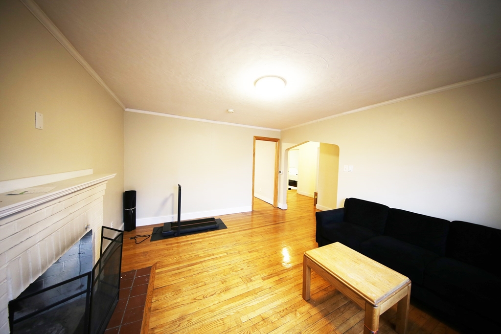 23 Heath Street, Unit 1 Brookline, MA 02445 - Photo 2 of 16 a living room with furniture