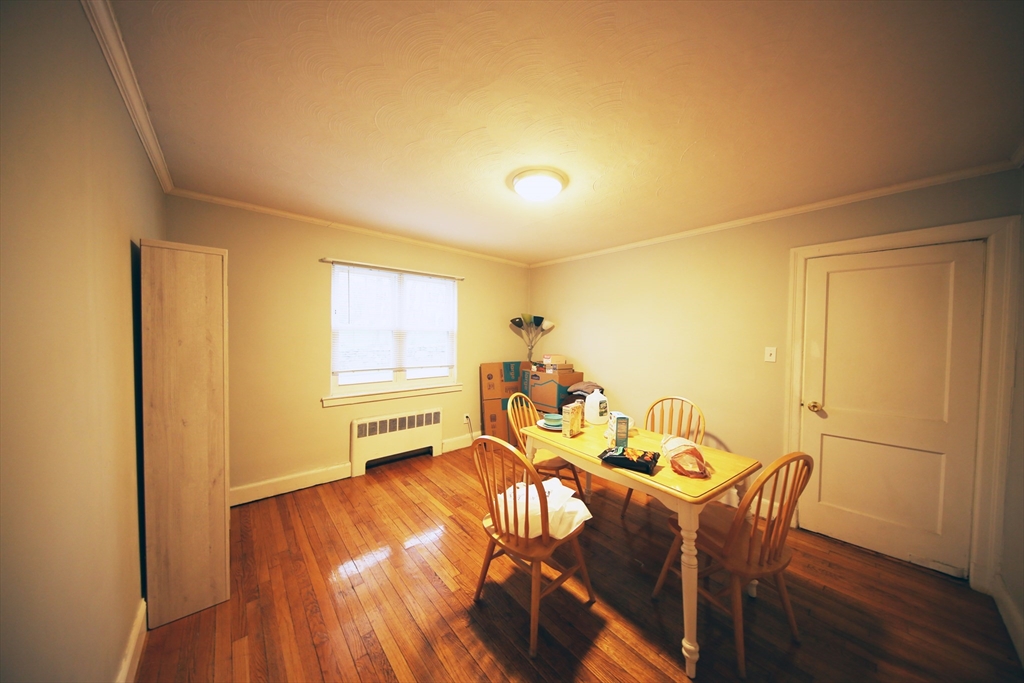 23 Heath Street, Unit 1 Brookline, MA 02445 - Photo 4 of 16 a dining room with furniture and a window