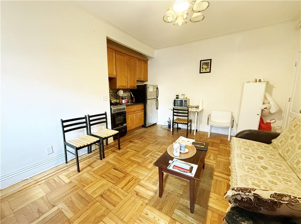 2940 Ocean Avenue, Unit B17 Brooklyn, NY 11235 - Photo 2 of 8 a living room with furniture and wooden floor