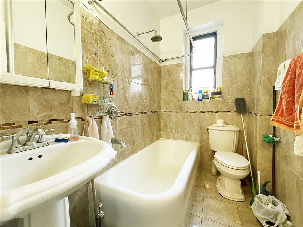 2940 Ocean Avenue, Unit B17 Brooklyn, NY 11235 - Photo 3 of 8 a bathroom with a sink and toilet