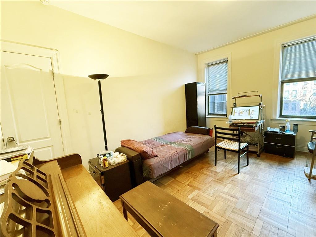 2940 Ocean Avenue, Unit B17 Brooklyn, NY 11235 - Photo 4 of 8 a bedroom with a bed and large windows