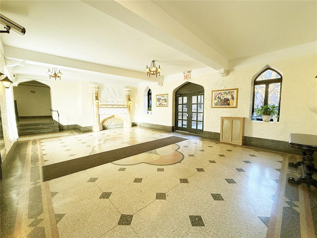 2940 Ocean Avenue, Unit B17 Brooklyn, NY 11235 - Photo 7 of 8 a spacious bathroom with a granite countertop sink and a mirror