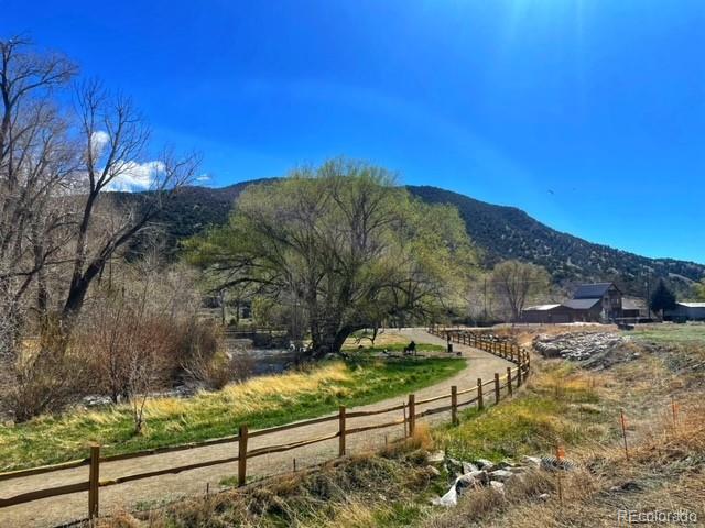 306 Southside Loop Salida, CO 81201 - Photo 11 of 37 a view of a bench in the middle of a yard