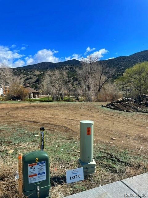 306 Southside Loop Salida, CO 81201 - Photo 19 of 37 a view of a lake with a building in the background
